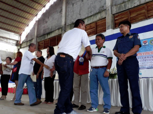 Department of Social Welfare and Development (DSWD) Field Office  X Regional Director Nestor Ramos (2nd from right) and other officials congratulate drug surrenderers from Sugbongcogon, Misamis Oriental who finished the 12-day Community-based Rehabilitation Program organized by the DSWD and other agency partners.