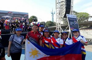 DSWD representatives, Asec. Hernandez, and Olympic Silver Medalist Hidilyn Diaz (third from right) at the conclusion of the culminating program for the Manila leg of the #RisingTogether Baton Run. ​